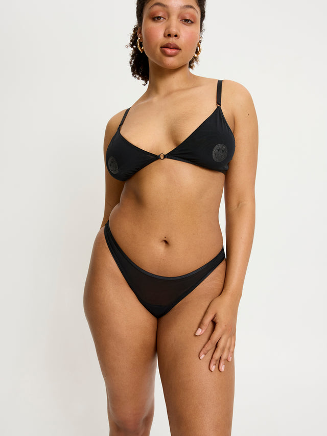 SPSCMHBLAW_Smileyworld_x_Modibodi_Sparkle_Cheeky_Brief_Moderate-Heavy_Black_LivS14_13984.jpg